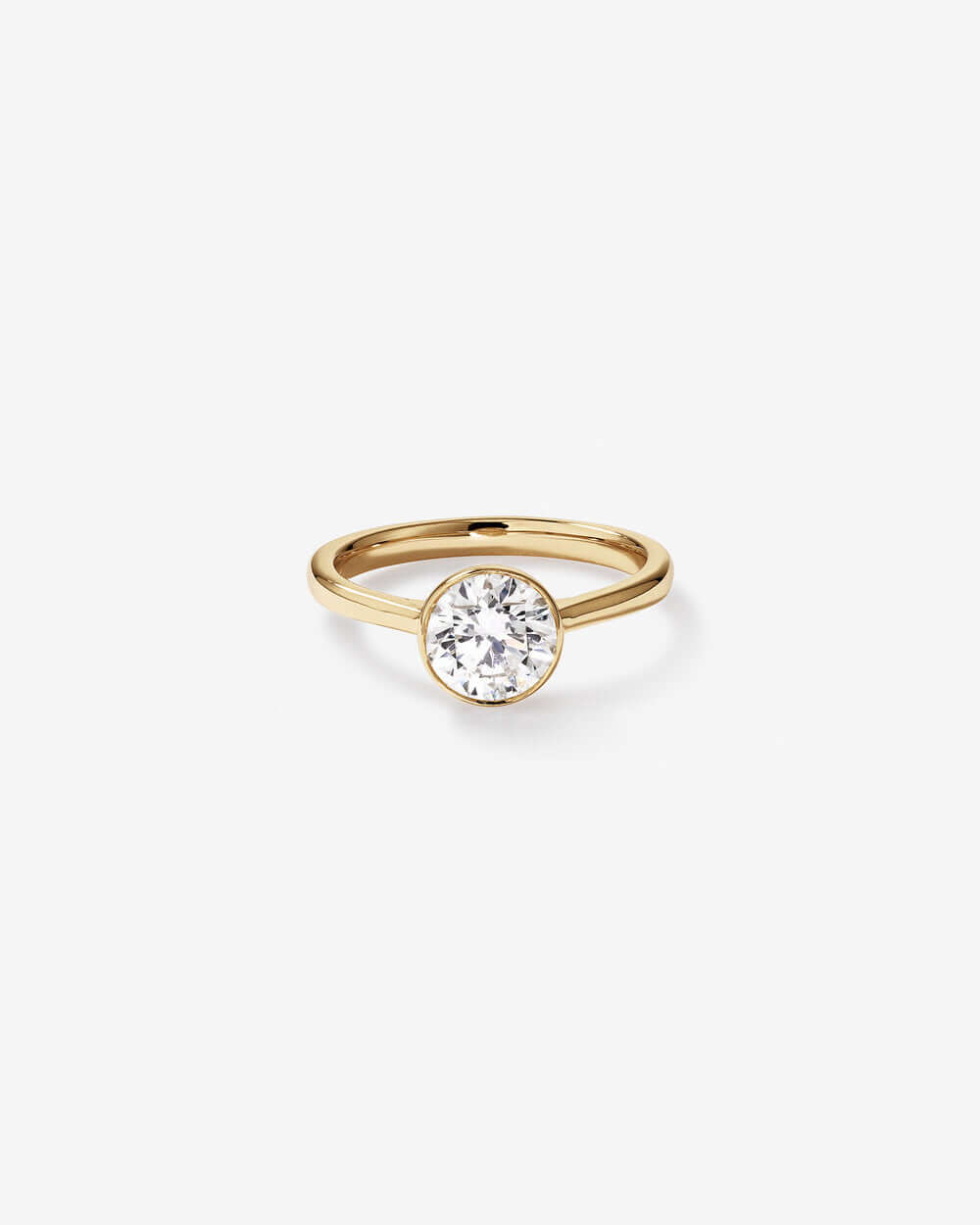 1.25 Carat TW Round Brilliant Laboratory-Grown Diamond Solitaire Bezel Set Engagement Ring in 14kt Yellow Gold Revat Jewels