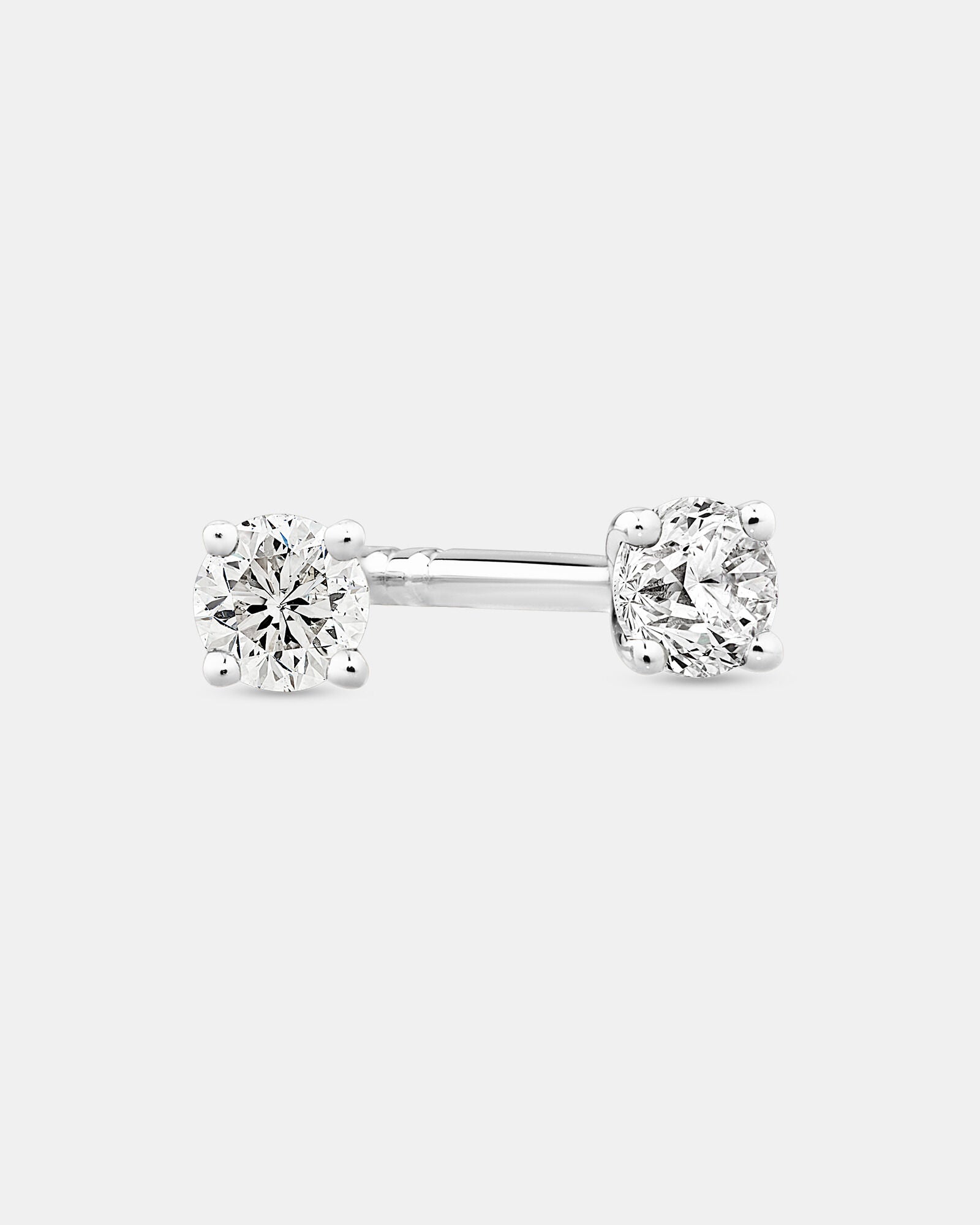 0.10 Carat TW Diamond Mini Solitaire Stud Earrings in White Gold Revat Jewels