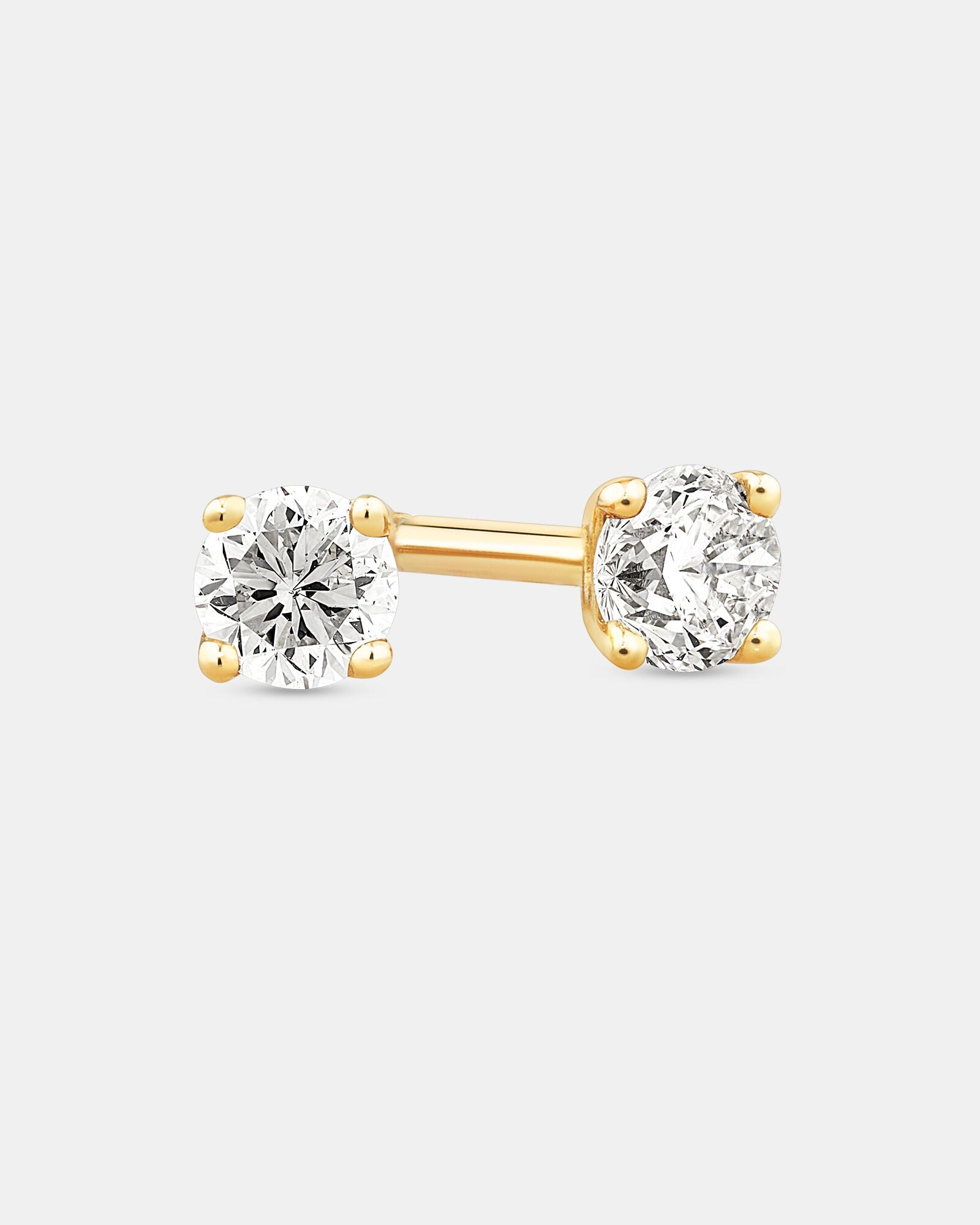 0.15 Carat TW Diamond Round Brilliant Mini Solitaire Stud Earrings in Yellow Gold Revat Jewels