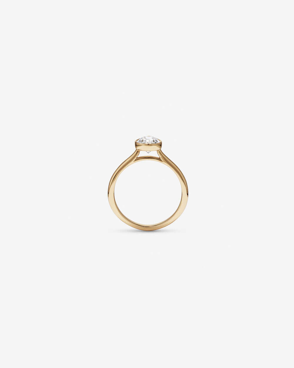 Pear Cut Bezel Set Engagement Ring showcasing modern elegance in gold with a stunning pear-shaped diamond.