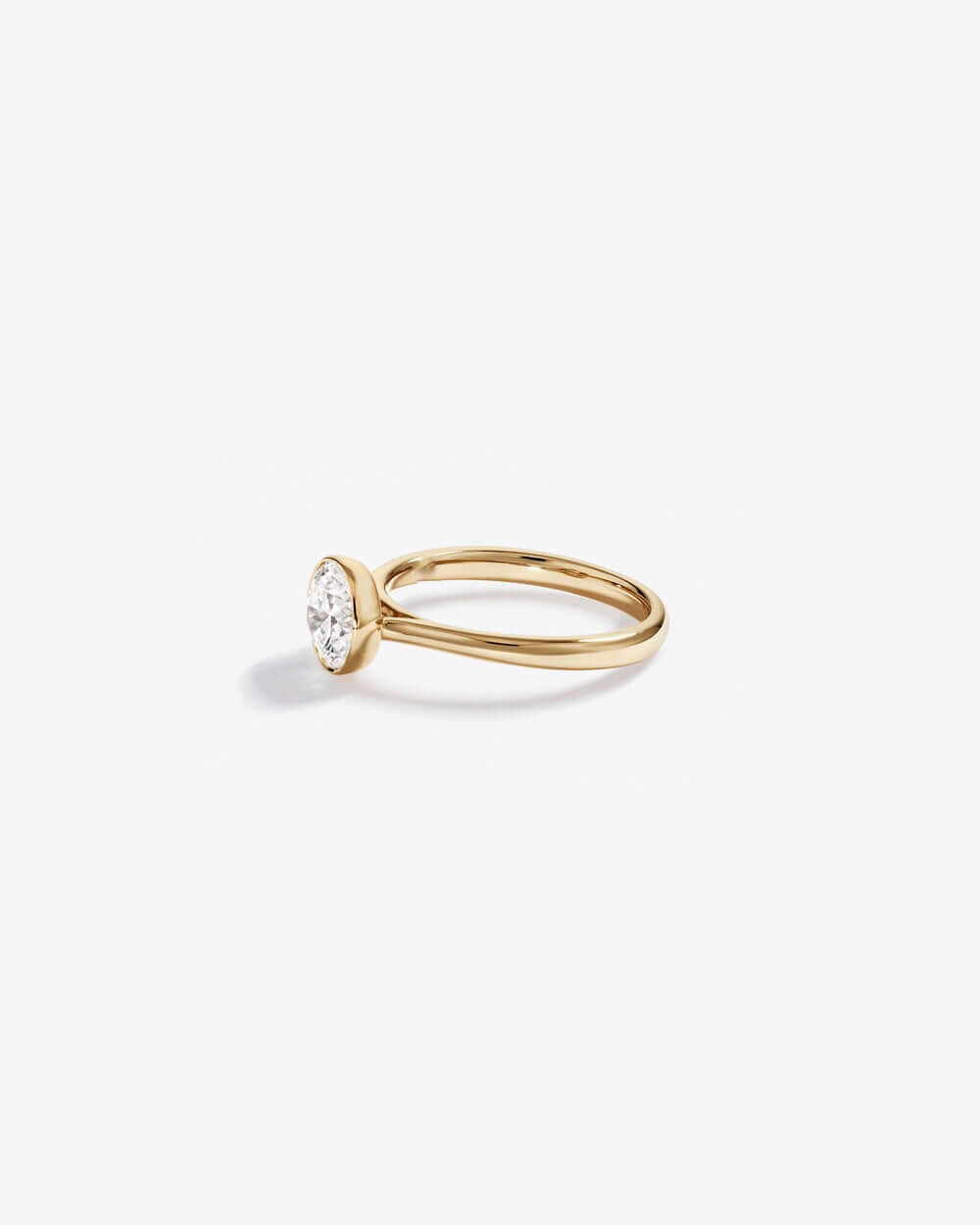 1.25 Carat TW Round Brilliant Laboratory-Grown Diamond Solitaire Bezel Set Engagement Ring in 14kt Yellow Gold Revat Jewels