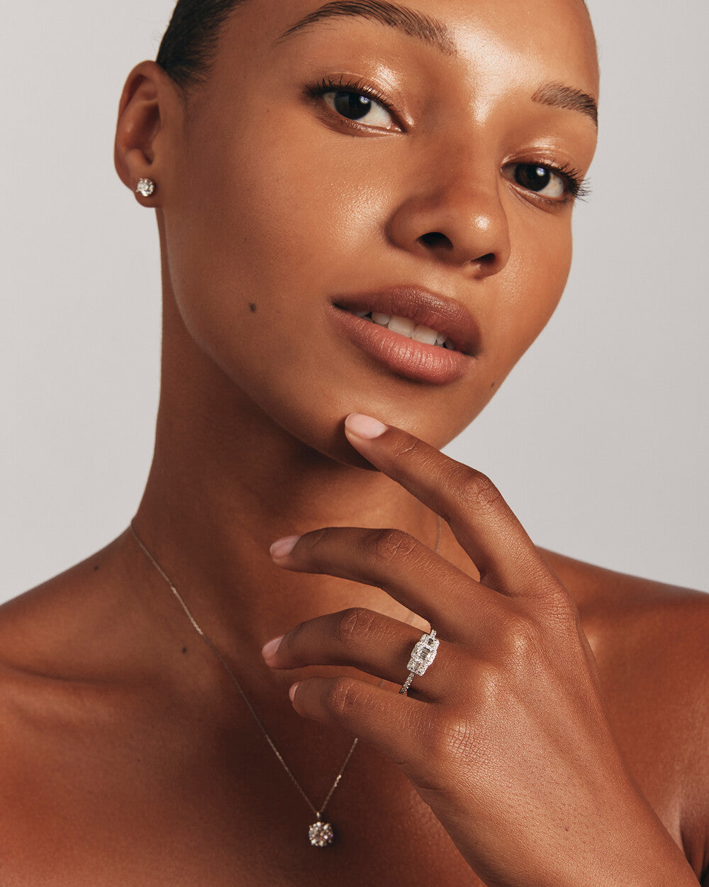 0.80 Carat TW Three Stone Emerald Cut Halo Engagement Ring in 14kt White Gold Revat Jewels